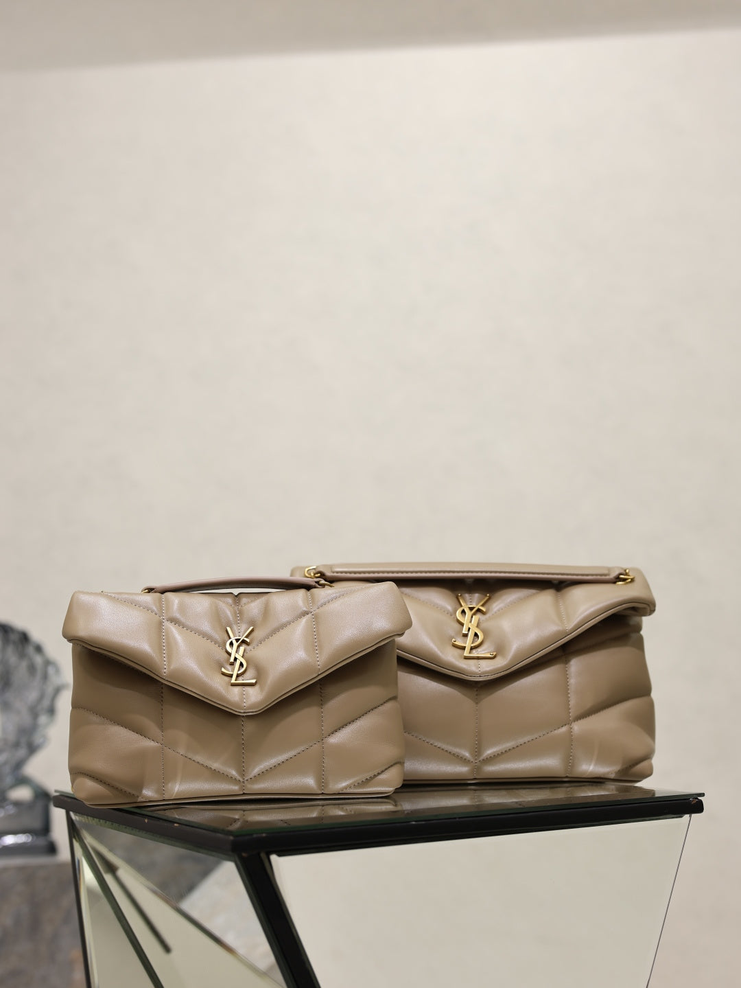 YSL quilted shoulder bag with flap, gold YSL logo, top handle and chain, beige