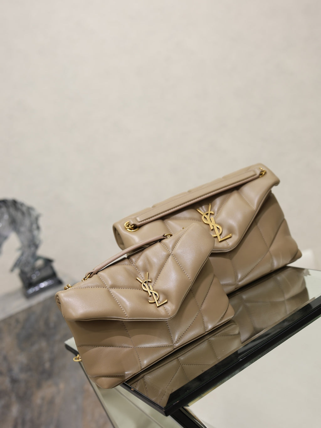 YSL quilted flap bag with gold YSL logo, short top handle, long chain strap, beige