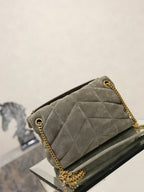 Gray YSL quilted shoulder bag with gold chain handle on side, flap clasp
