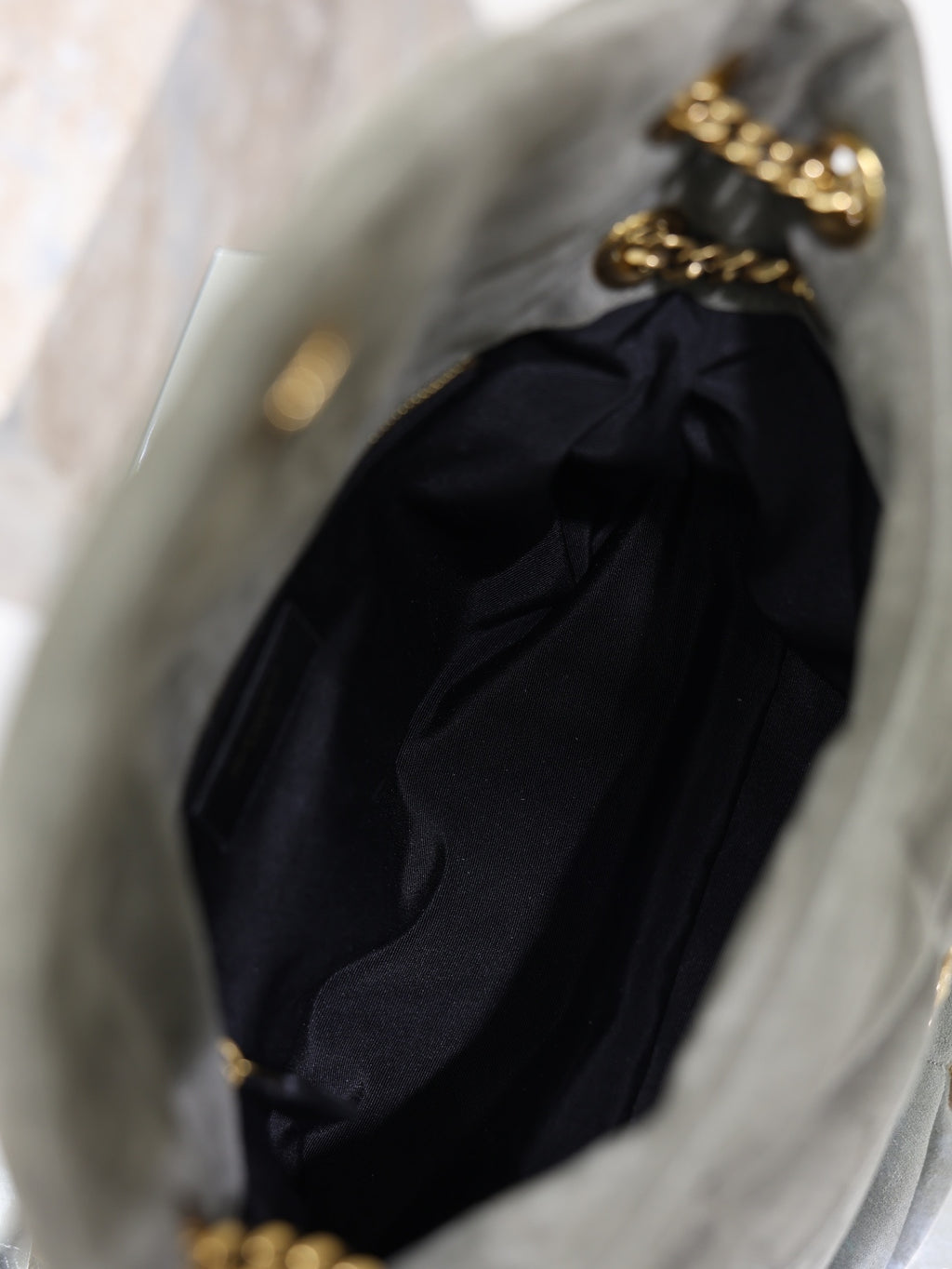 Black YSL shoulder bag with gathered fabric and gold chain strap, open top