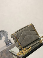 Gray suede shoulder bag with quilted flap, gold chain strap, small hardware
