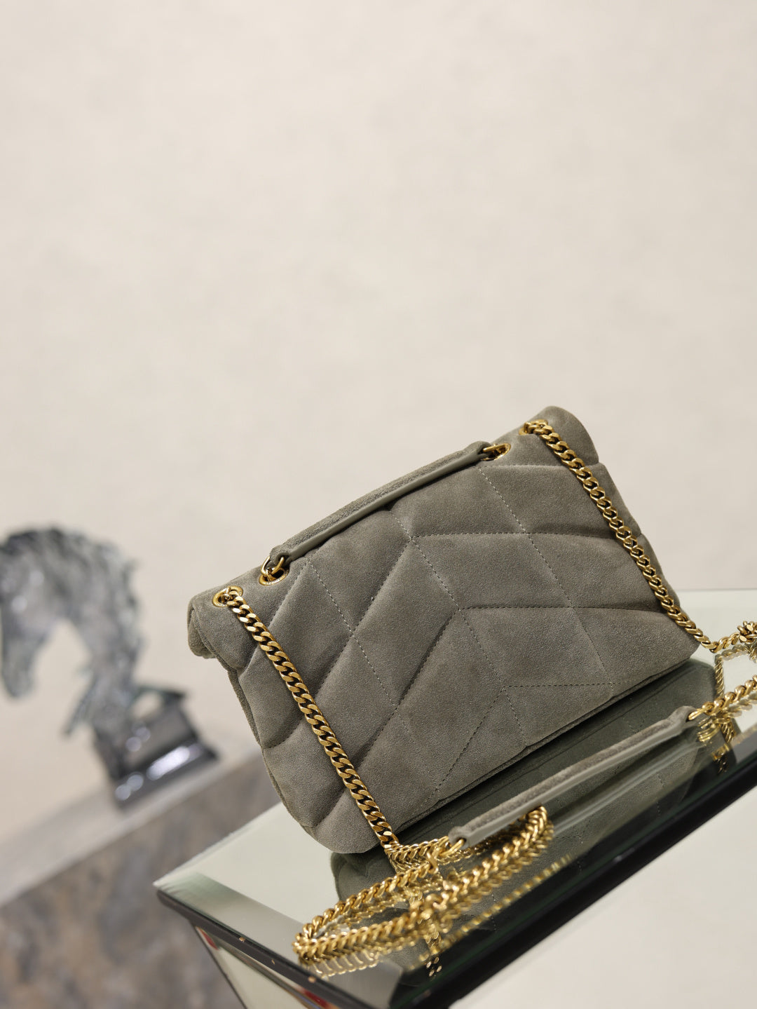 Gray suede shoulder bag with quilted flap, gold chain strap, small hardware