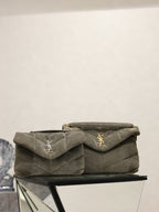 Quilted gray shoulder bag with flap, gold YSL logo, and chain strap