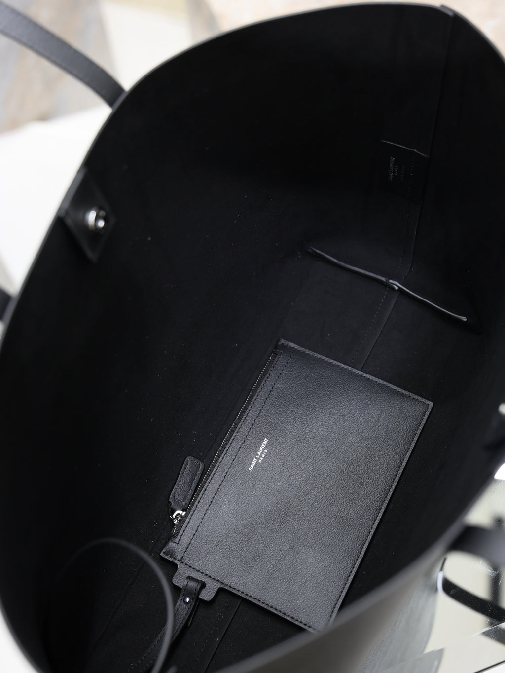 YSL black tote interior with zip pocket and card slot panel
