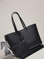 YSL black tote bag with two top handles and front hanging accessory