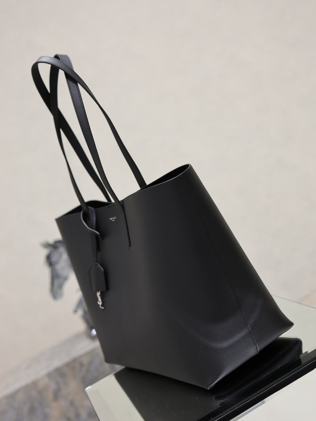 YSL black leather tote bag with structured sides and long top handles