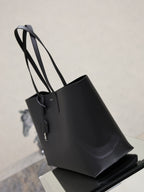 YSL black leather tote bag with structured sides and long top handles