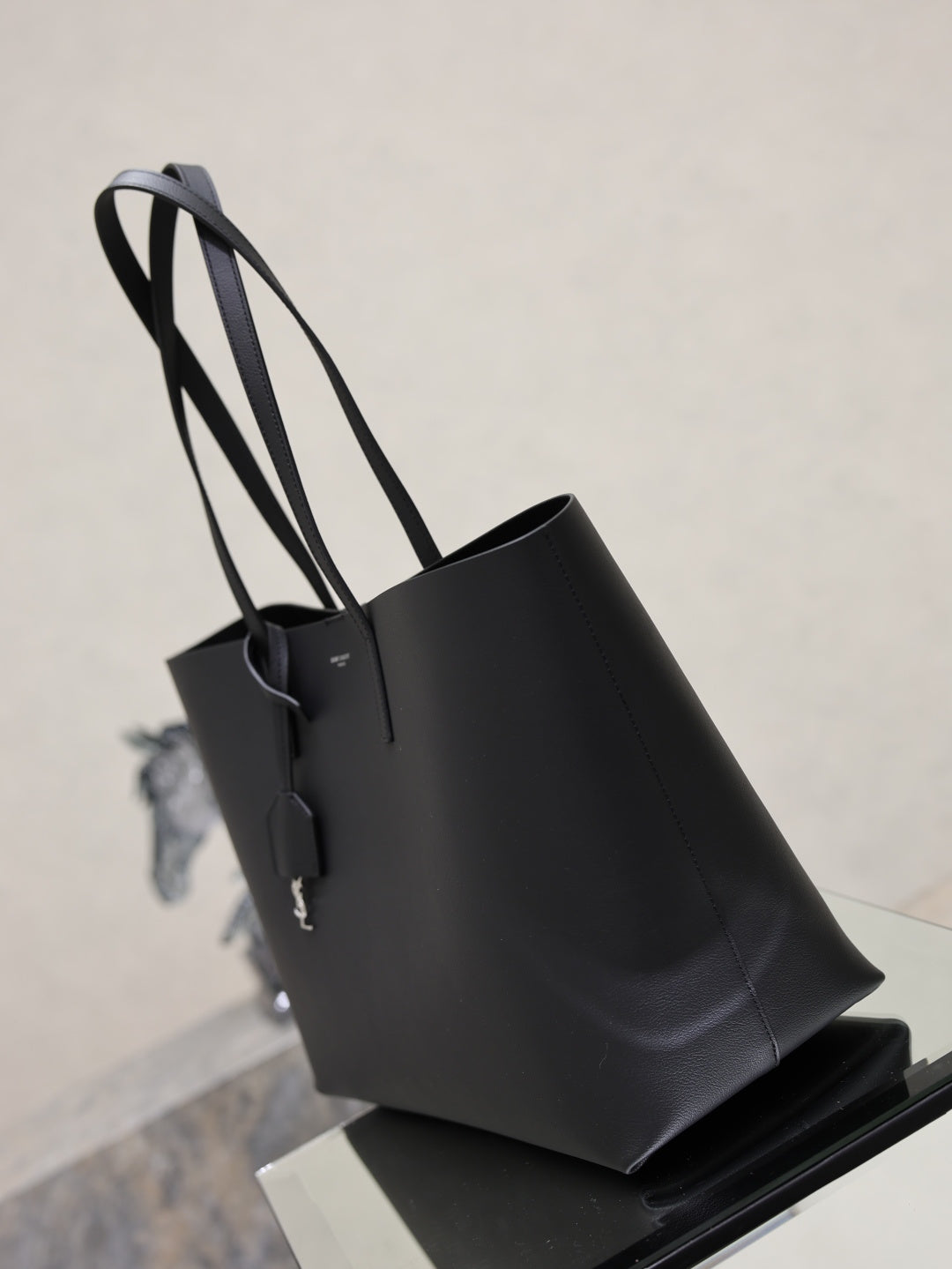 YSL black leather tote bag with structured sides and long top handles