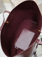 YSL burgundy tote bag interior view with pocket and gray card holder