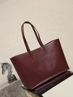 YSL burgundy tote bag front view with twin top handles and minimal branding
