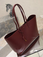 YSL burgundy tote bag with wide handles and front strap with gold logo