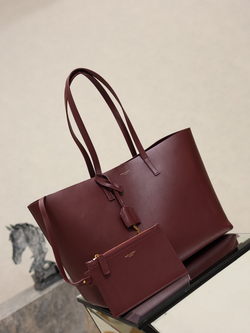 YSL burgundy tote bag with double top handles and front strap detail
