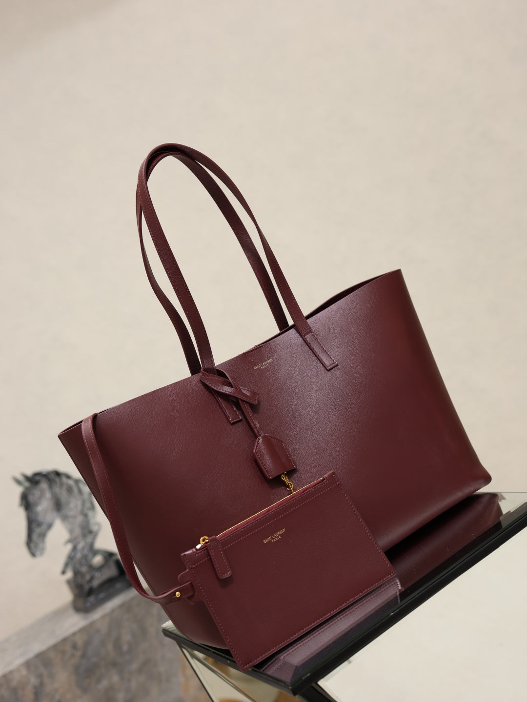 YSL burgundy tote bag with double top handles and front strap detail