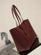 YSL burgundy large tote bag angled view with top handles and front emblem