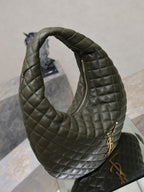 Quilted hobo shoulder bag with front zipper opening and gold hardware