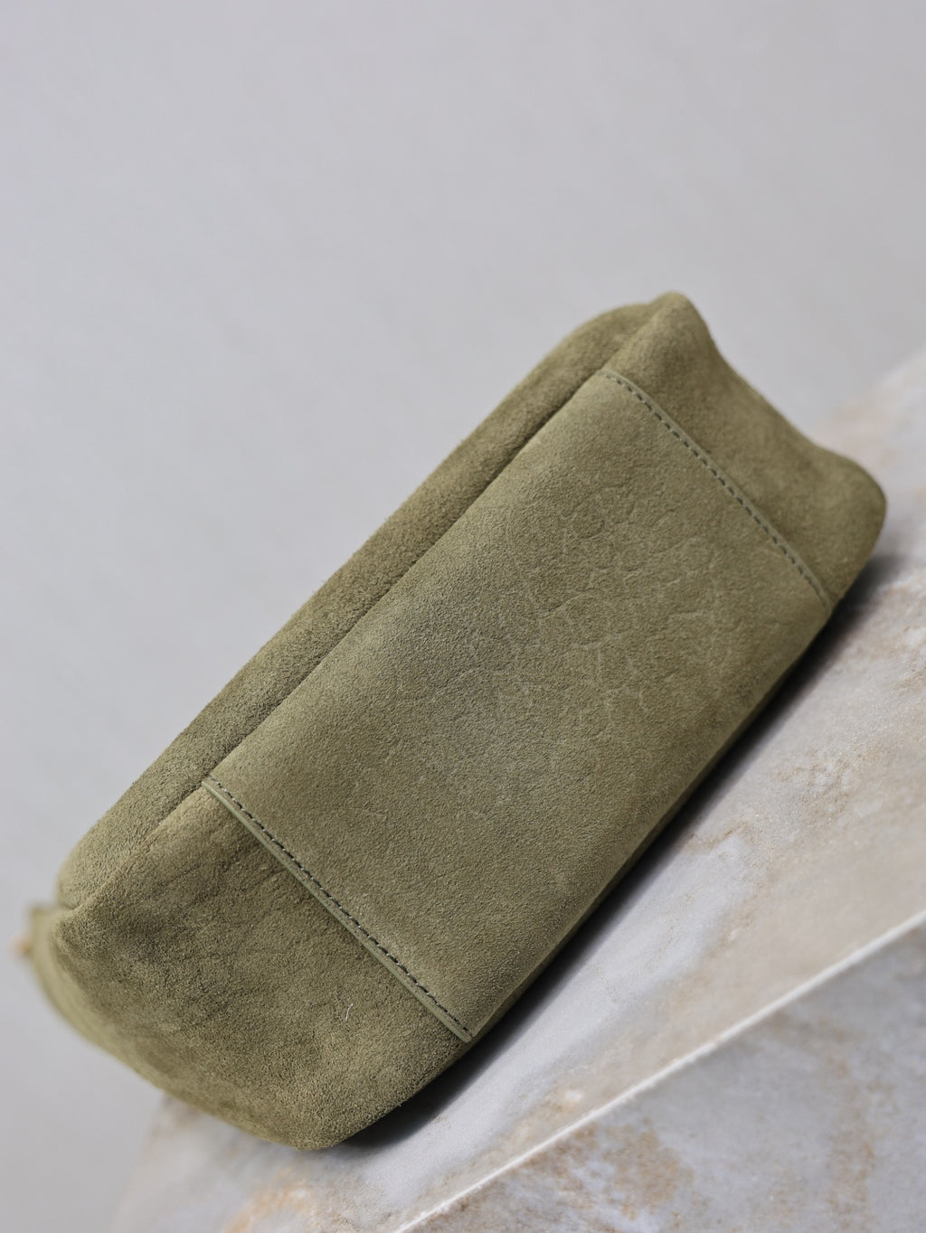 YSL bag in olive suede with flat side panel and stitched edge trim