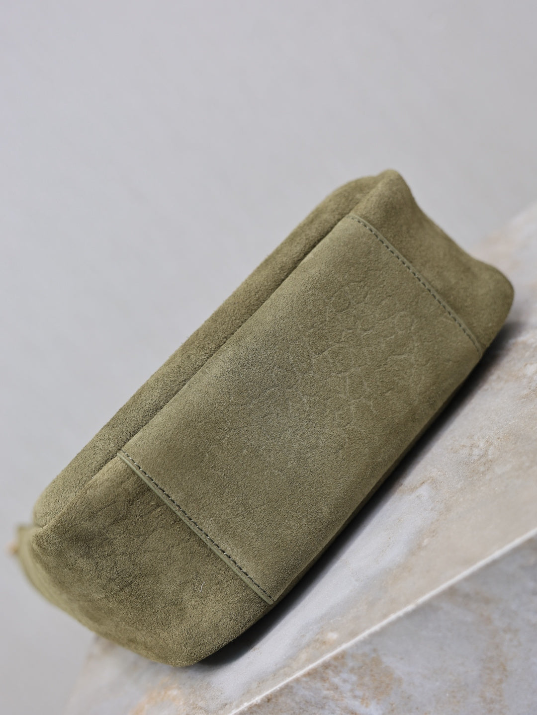 YSL bag in olive suede with flat side panel and stitched edge trim