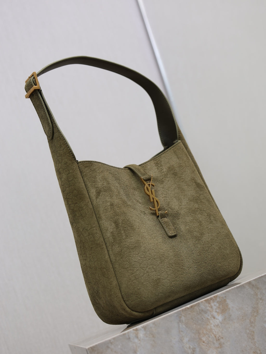 YSL bag in olive suede with long strap handle and front YSL zipper pull