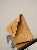 YSL envelope clutch bag open, textured tan with fabric lining and gold logo