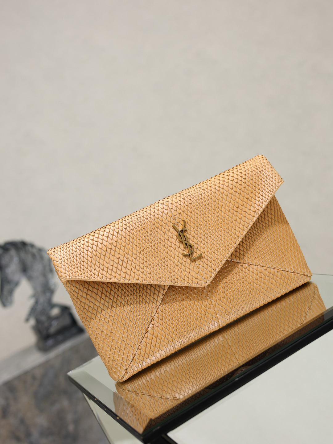 YSL envelope clutch bag, textured tan with flap and gold-tone YSL logo