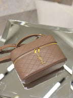 Taupe quilted mini bag on display with crossbody strap and gold-tone YSL clasp.