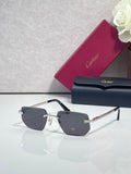 Cartier glasses with dark frames, gold metal arms, and gray tinted lenses on display
