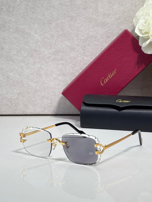 Cartier eyeglasses with gold metal frame, dark arms, and purple-tinted lenses