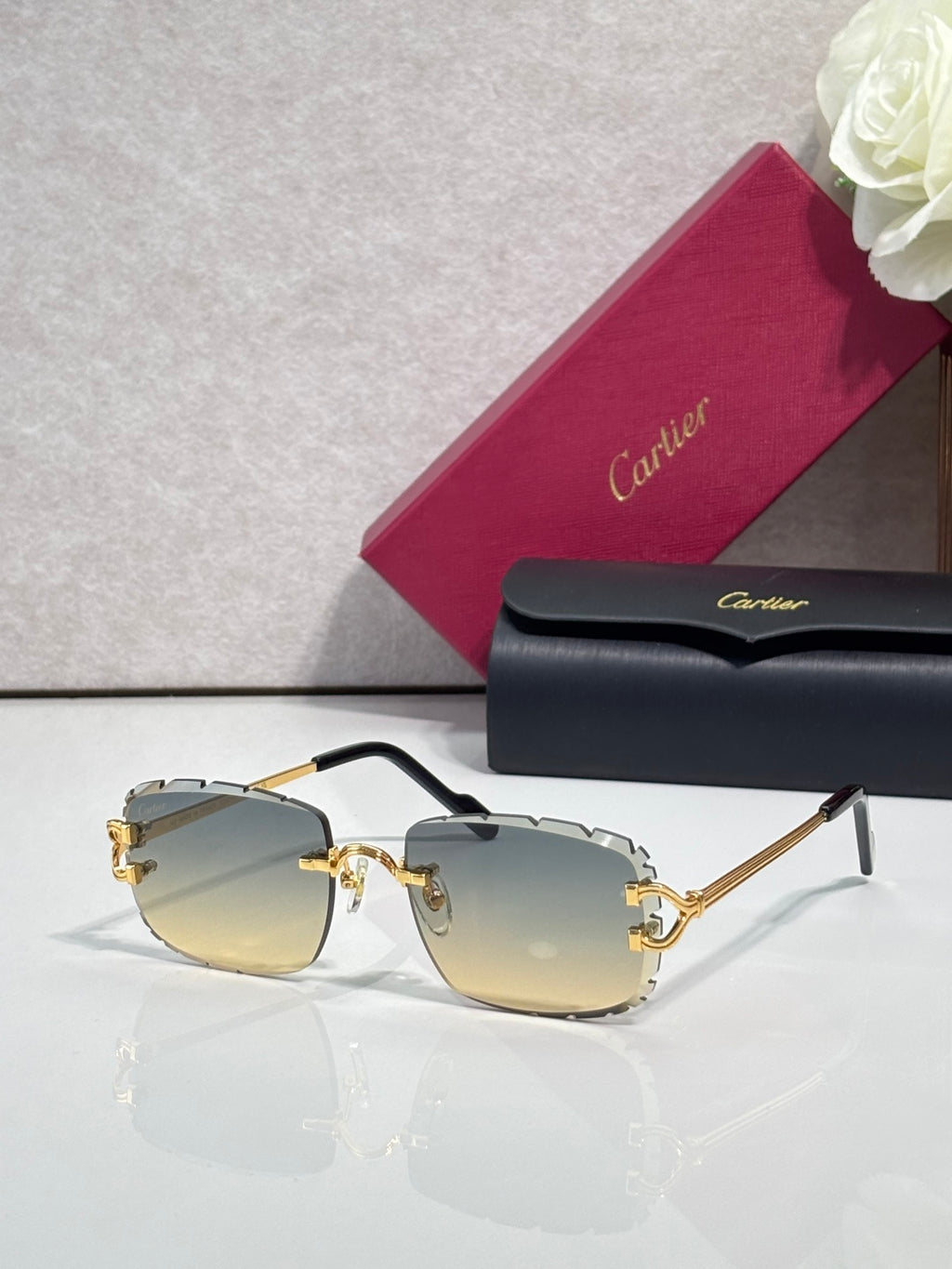 Cartier eyeglasses with gold metal frame, dark arms, and golden yellow-tinted lenses
