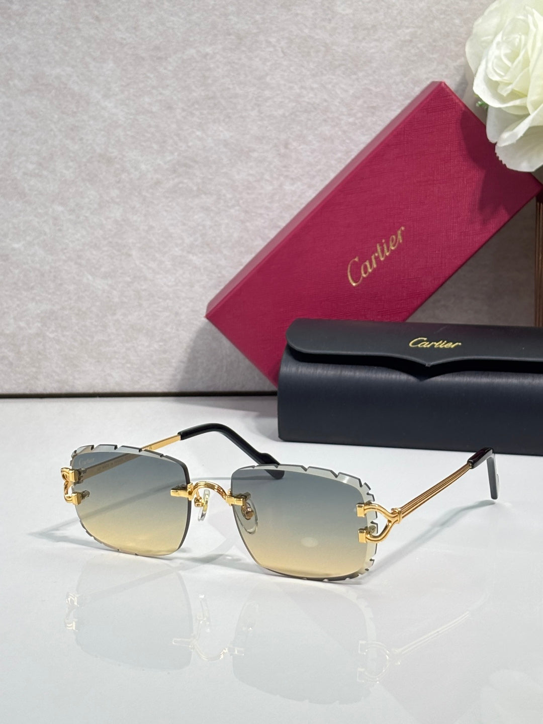 Cartier eyeglasses with gold metal frame, dark arms, and golden yellow-tinted lenses
