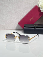 Cartier eyeglasses with gold metal frame, dark arms, and dark blue-gray-tinted lenses