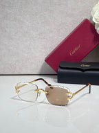 Cartier eyeglasses with gold metal frame, dark arms, and brown-tinted lenses