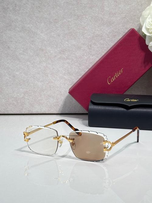 Cartier eyeglasses with gold metal frame, dark arms, and brown-tinted lenses