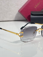 Gold metal eyeglasses with dark gradient lenses and angular frame shape