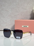 MiuMiu square black glasses with dark tinted lenses and gold-tone hinges