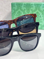 Gucci sunglasses set with tortoiseshell and black frames, dark lenses