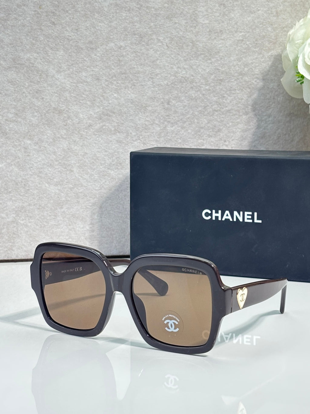 Square acetate sunglasses, dark tortoise frame with brown tint lenses and Chanel logo