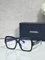Square acetate sunglasses, black frame with light lenses and Chanel logo