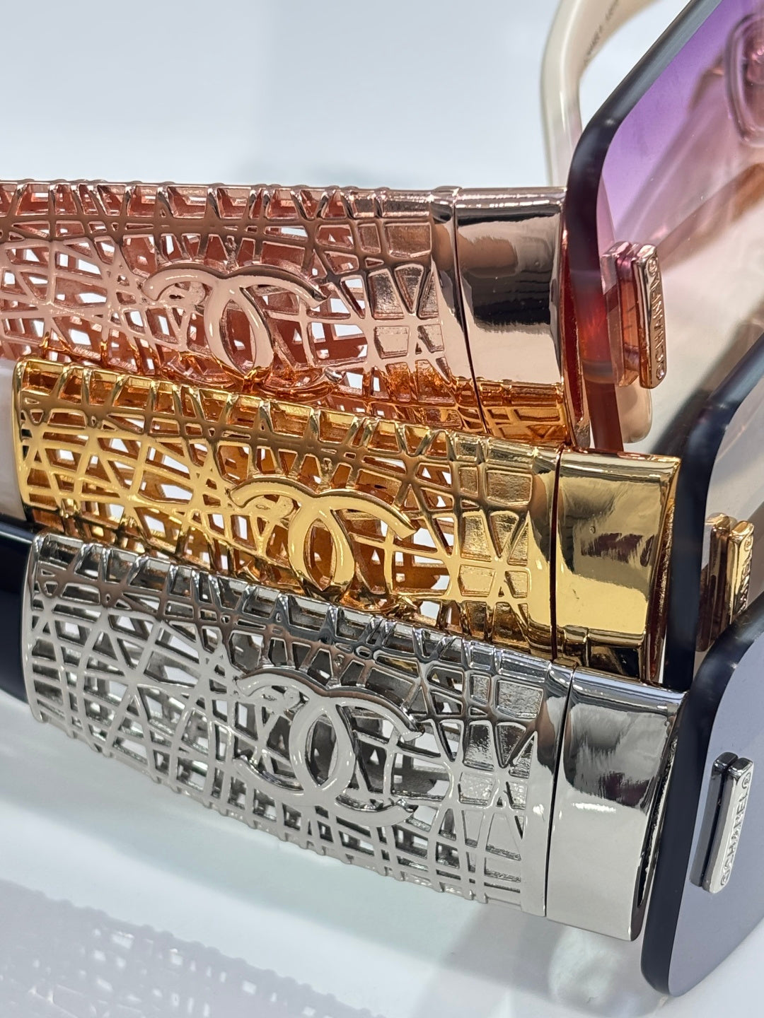 Chanel sunglasses temple close-up with gold and silver lattice metal trim