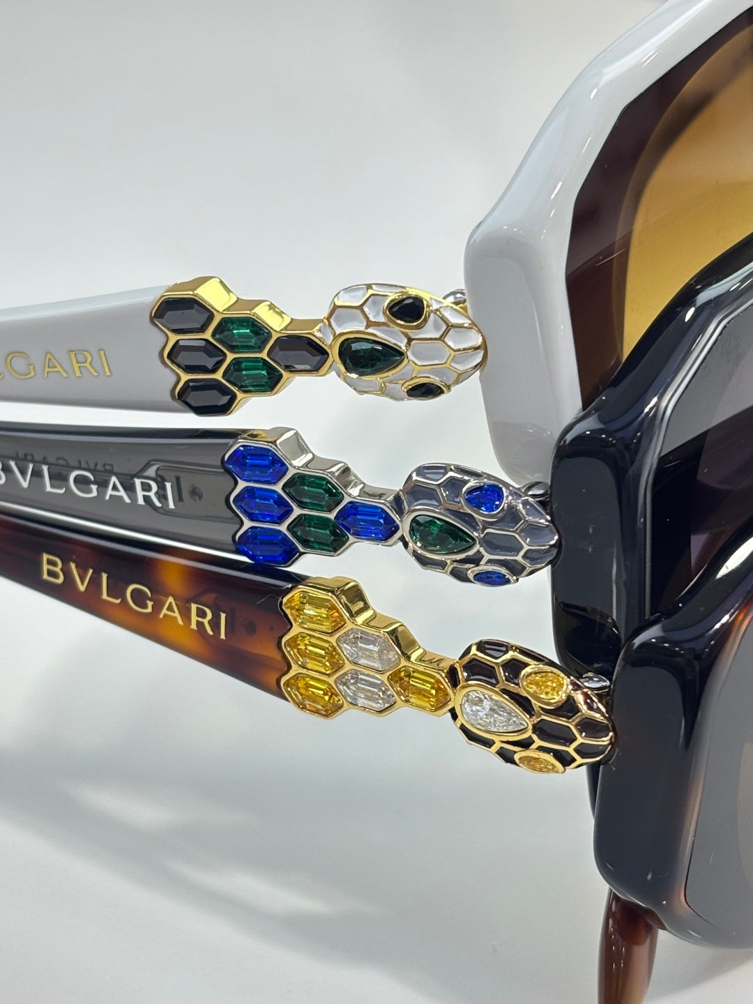 Bvlgari sunglasses temple detail with multicolor enamel hexagon emblem and gold accents