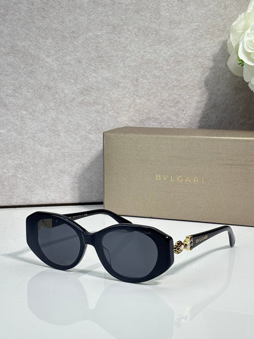 Bvlgari sunglasses with dark lenses, navy round frames, and light gray temple details