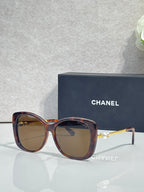 Chanel glasses with tortoiseshell square frames, tinted brown lenses, gold-tone temples