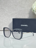 Chanel glasses with dark blue square frames, clear lenses, gold-tone temples