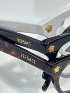Versace optical glasses, black temples with gold Medusa emblem and branding.