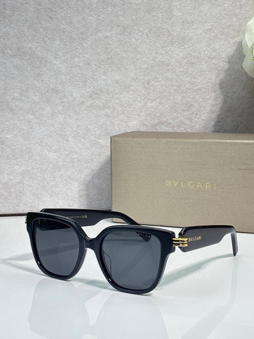 Black square sunglasses with dark lenses, gold-tone hinge detail, BVLGARI logo