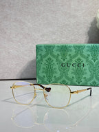 Gucci round eyeglasses with thin gold metal frame and clear lenses