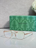 Gucci round eyeglasses with thin gold metal frame and clear lenses