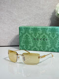 Gucci sunglasses with gold frame and clear yellow-tinted lenses