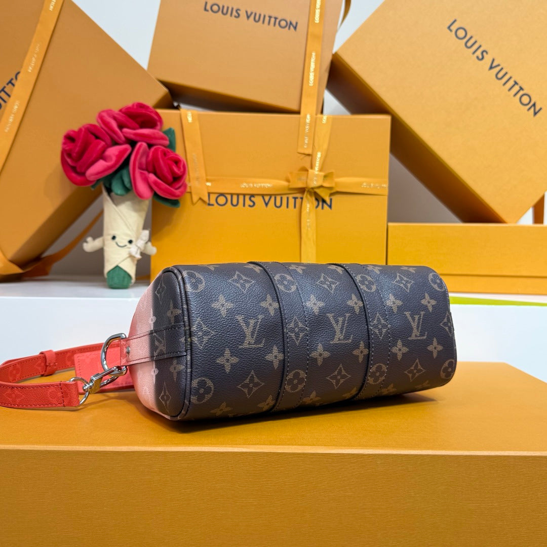 Louis Vuitton monogram duffel-style bag in dark blue with red shoulder strap