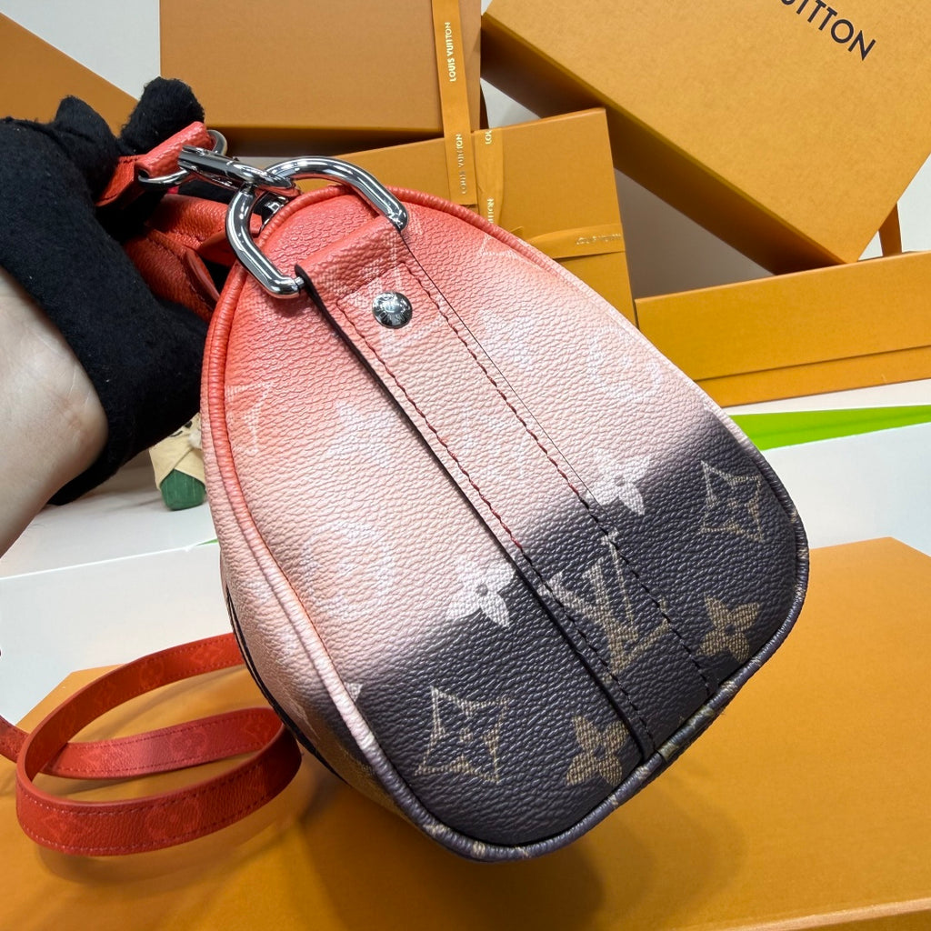 Louis Vuitton monogram crossbody wristlet in pink-to-dark brown with attached strap