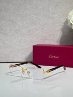 Cartier glasses with gold and tortoiseshell frame, clear rectangular lenses
